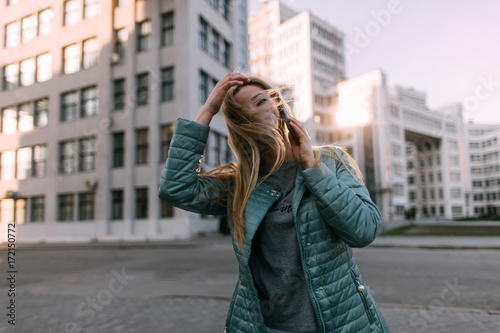 Passerby talk on phone in city. Modern communication, social media technology © Photodrive