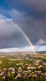 Aerial view of a rainbow over a small Welsh town