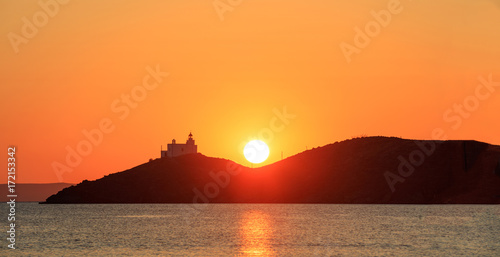 Greece, Seascape with lighthouse on Kea island at sunset