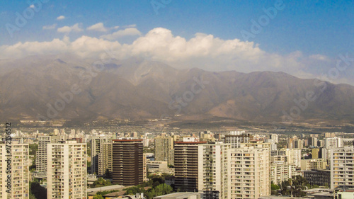 Tall buildings in Santiago's skyline with Andes mountains in the background