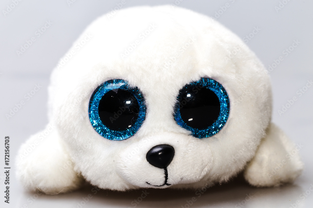 A white baby seal plush toy with big blue eyes. Furry cute animal. Stock  Photo | Adobe Stock