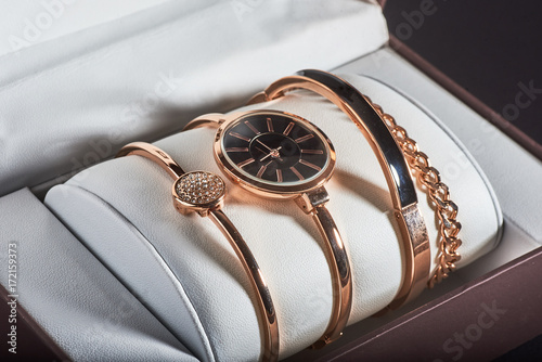 golden women's wrist watch on a white background