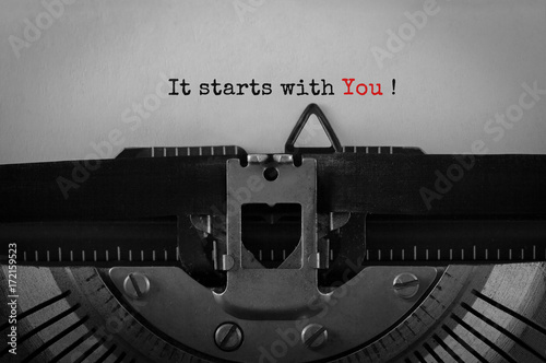 Text It starts with You typed on retro typewriter