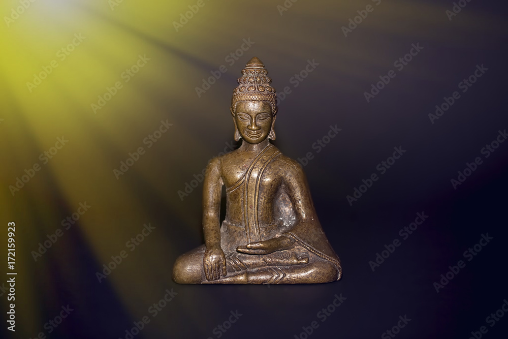 Buddhist meditation. Traditional bronze buddha meditating in rays of divine light. Zen buddhism and spiritual enlightenment or awakening. Buddhist meditation. Traditional bronze buddha meditating in rays of divine light. Zen buddhism and spiritual enlightenment or awakening.