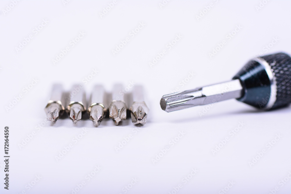 Exchangeable magnetic screwdrivers with multiple heads. White background. Exchangeable magnetic screwdrivers with multiple heads. White background.