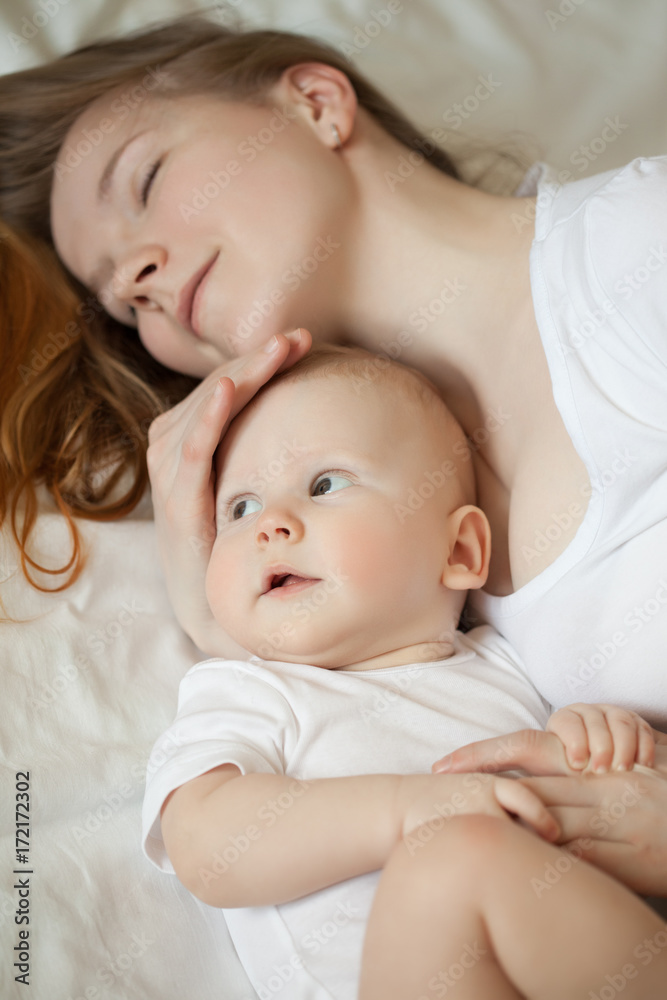 Mom and baby. Mother with daughter or son. Tenderness and embrace, happiness maternity, home comfort and warmth. Mom and baby. Mother with daughter or son. Tenderness and embrace, happiness maternity, home comfort and warmth.