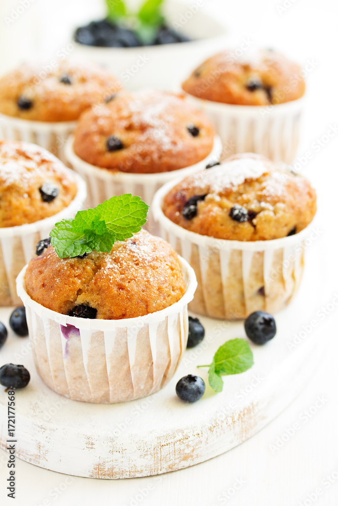 Oat muffins with blueberries on a dark background. Oat muffins with blueberries on a dark background.