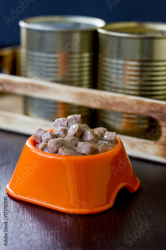 Canned pet food in a orange...