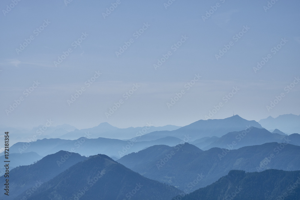 Mountain tops covered in morning haze seen from the top of the Panoramastrasse on Mt. Goldeck