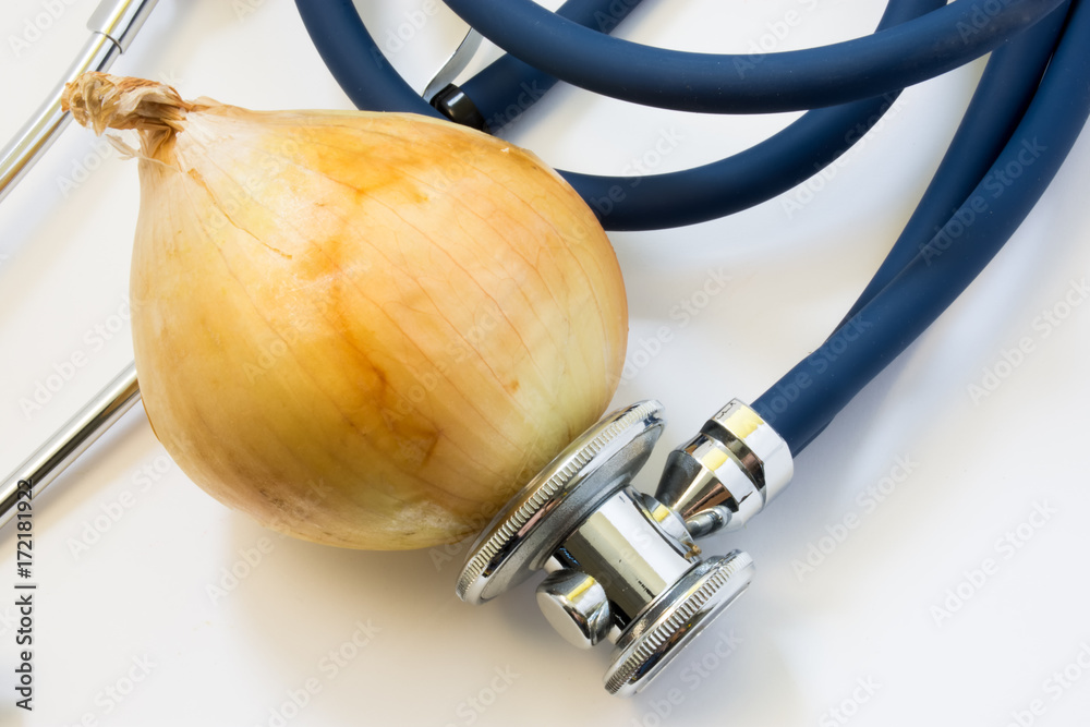 Fotka „Onion and stethoscope. Stethoscope tests onion for presence of