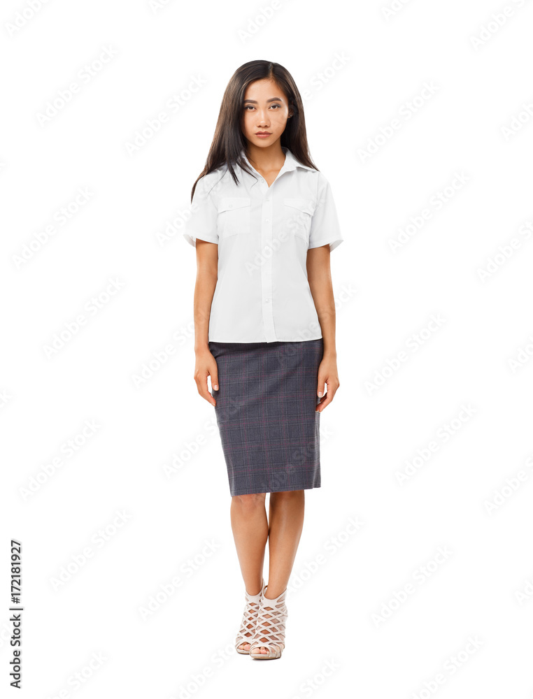 Serious Asian young woman in full length isolated on white Serious Asian young woman in full length isolated on white