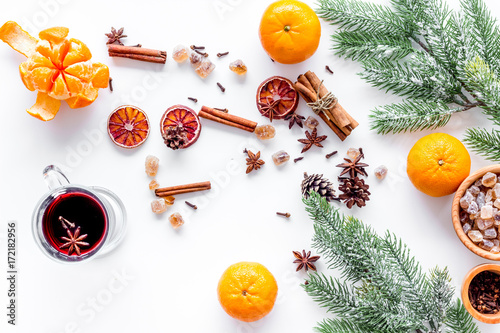 Celebrate new year winter evening with hot drink. Mulled wine or grog ingredients. White background top view.