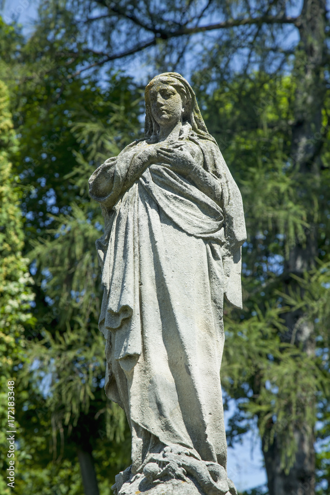 Virgin Mary ancient statue (Prayer, faith, religion, love, hope concept)