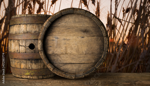 Fotografering background of barrel and worn old table of wood