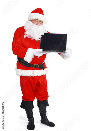 Santa Claus presents a laptop on white background