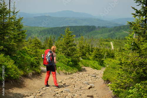 Fototapeta Naklejka Na Ścianę i Meble -  Hikings along tourist trails in the mountains Beskid in Poland with the backpack on the back