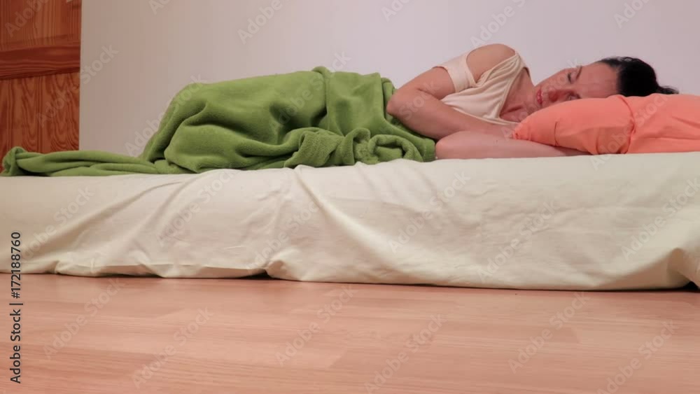 Camera focusing on woman who sleeping on air mattress Stock ビデオ Adobe