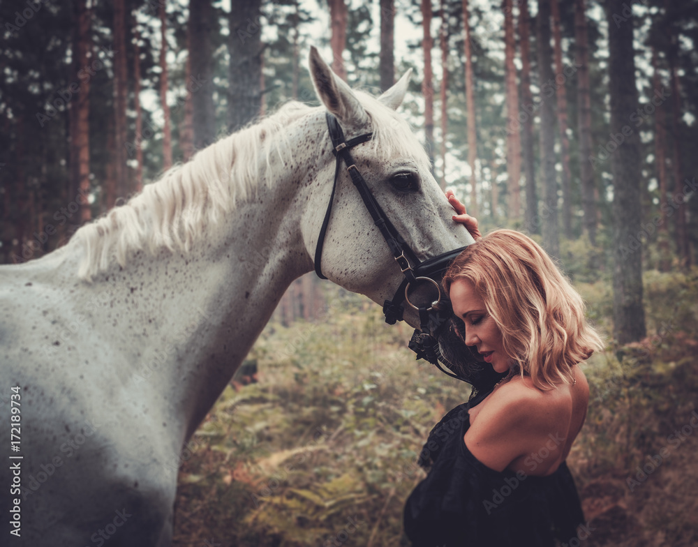 Fototapeta premium Romantic middle-aged woman with her horse