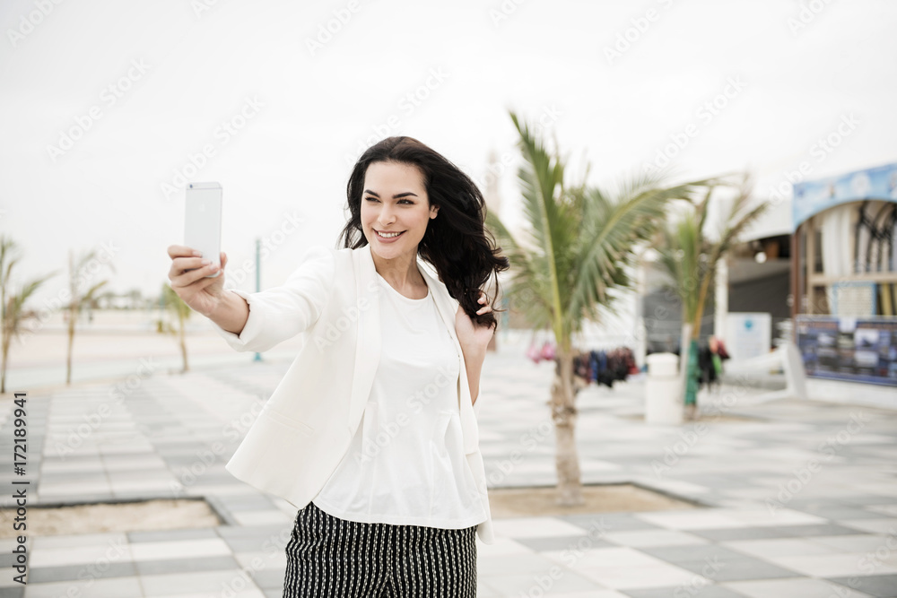 Woman communicating with cellphone