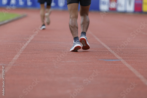 Male running jogging in stadium healthy exercise.