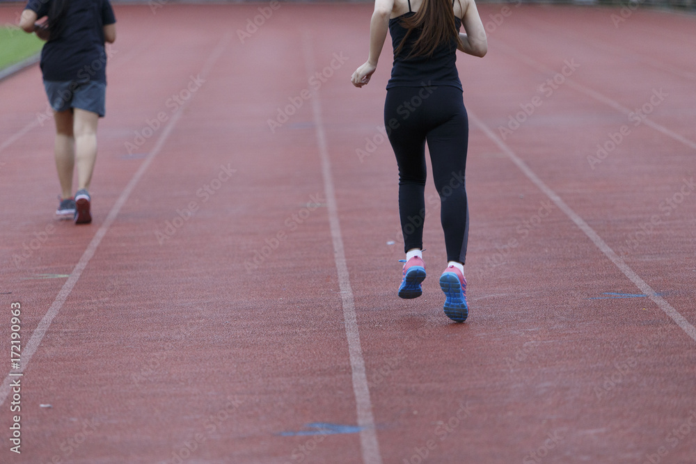 woman running jogging in stadium healthy exercise. woman running jogging in stadium healthy exercise.