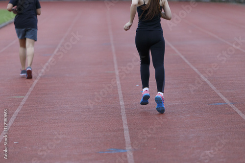 woman running jogging in stadium healthy exercise.