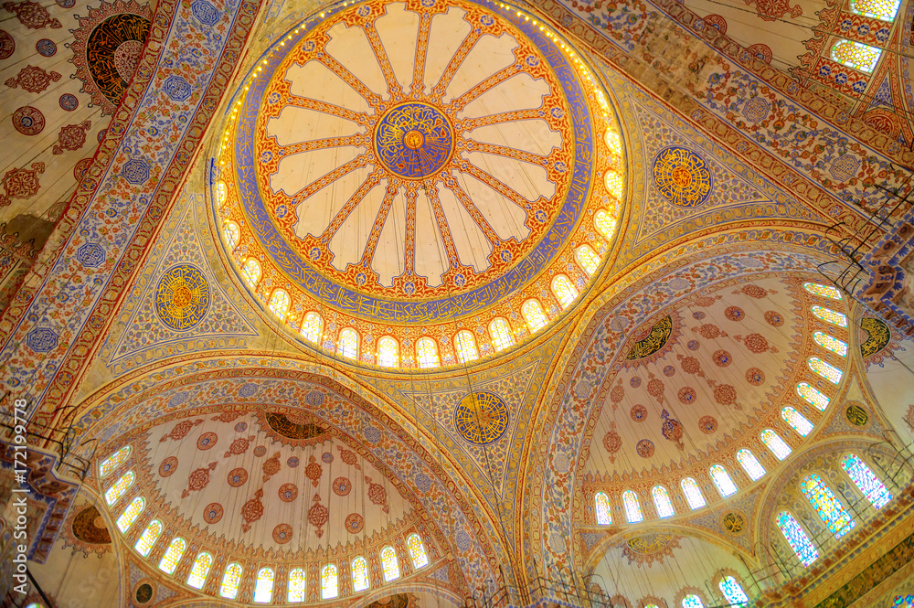 blue mosque in Istanbul, a lot of sunlight penetrates through the windows in the domes