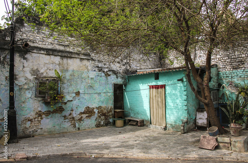 Old house and yard in one of the streets New Delhi, India