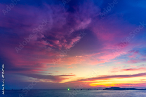 Beautiful tropical sunset in Krabi, Thailand. Dramatic and picturesque evening scene. Ocean and colorful pink cloudy sky in the background. Nature landscape. Travel background. Bright purple toning © Goinyk