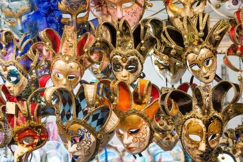 Beautiful Venetian masks background. Street shop in Venice Italy outdoors. Tourism and travel concept.