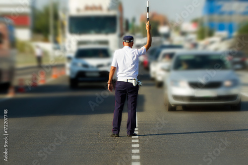 the policeman regulates the traffic
