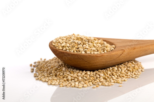 Pile of grain quinoa seeds in spoon