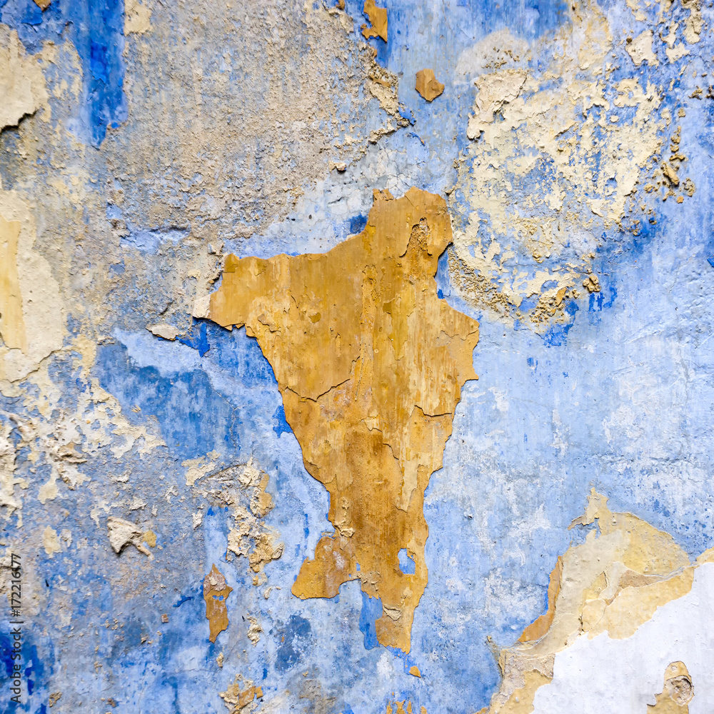 Grunge concrete background with peeling off paint