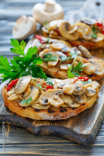 Crostini with baked eggplant, peppers and onions.