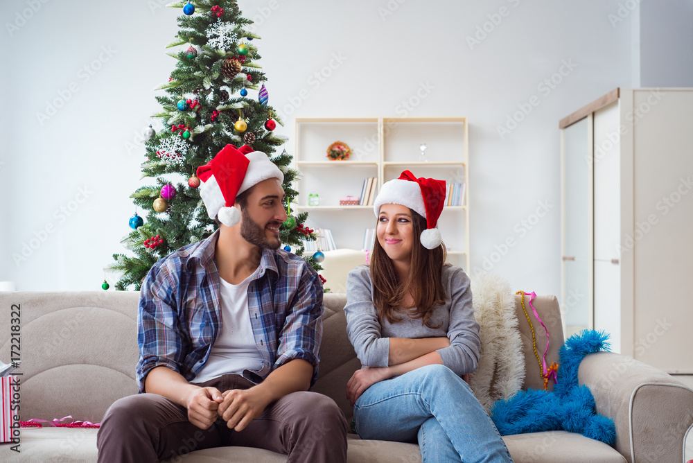 Fototapeta premium Happy couple celebrating christmas holiday