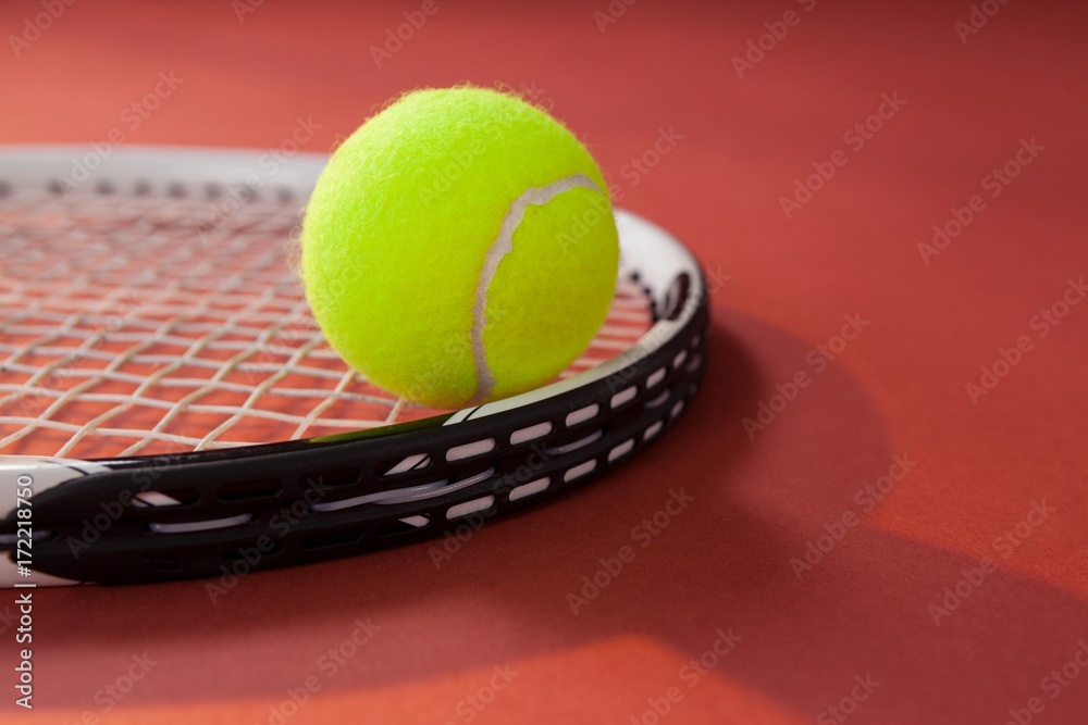 Close up of tennis ball on racket