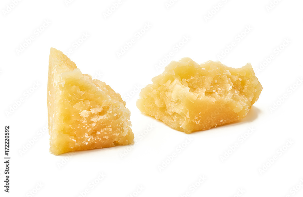 Pieces of Parmesan cheese on white background. Macro photography with great depth of field. DoF . Pieces of Parmesan cheese on white background. Macro photography with great depth of field. DoF .