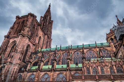 Huge tower and elegant exterior architecture of Notre dam of Strasbourg cathedral in Strasbourg, France photo