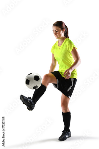 Female Soccer Player Balancing Ball