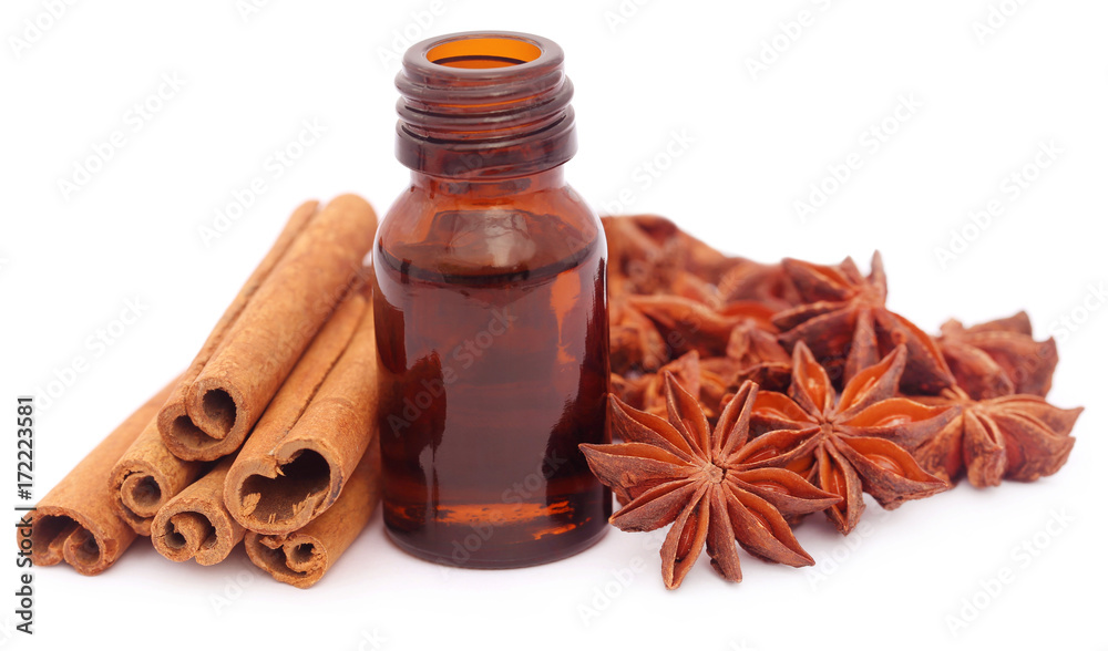 Some aromatic cinnamon with star anise and essential oil Some aromatic cinnamon with star anise and essential oil