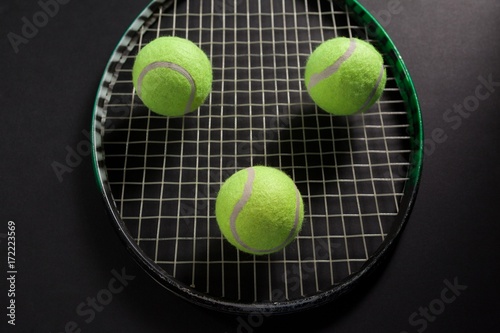 High angle view of balls on tennis racket © WavebreakMediaMicro