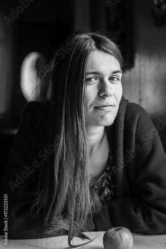 Attractive young long-haired woman. Seventies style closeup black-and-white portrait. .