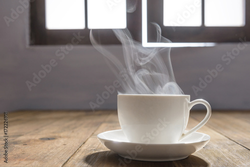 Steaming cup of hot coffee photo