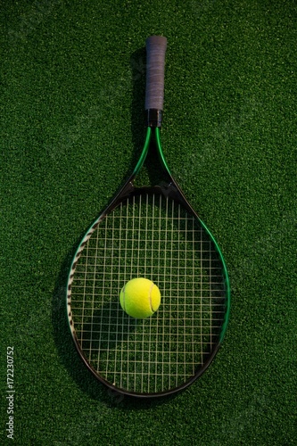 Overhead view of racket with tennis ball