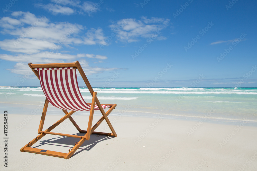 Deck chair on a beach. Deck chair on a beach.