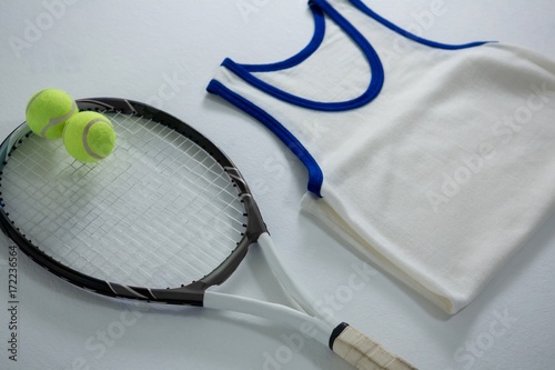 High angle view of racket with tennis balls by vest © WavebreakMediaMicro