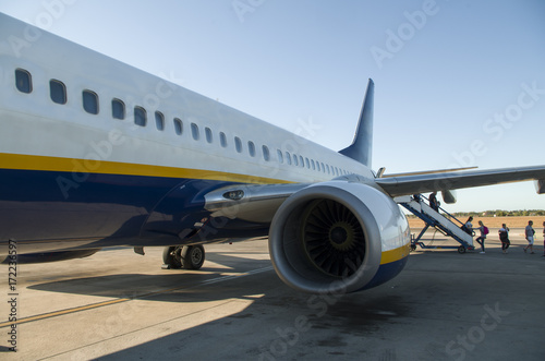 Passengers boarding on a plane