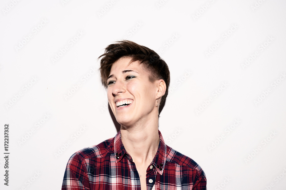 Laughing brunette with hairstyle looking away Laughing brunette with hairstyle looking away