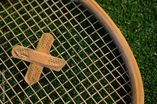 Cropped image of racket with bandage