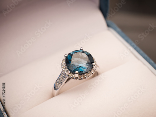 Jewel gemstone ring on black background